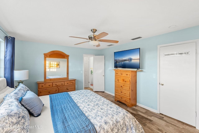 bedroom with hardwood / wood-style flooring and ceiling fan