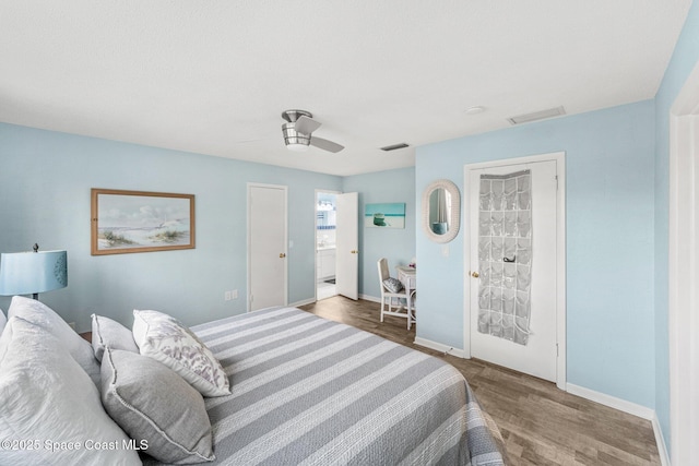 bedroom with hardwood / wood-style floors