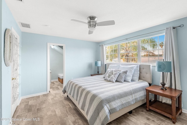 bedroom with light hardwood / wood-style flooring and ceiling fan