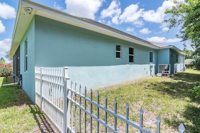 rear view of property with stucco siding