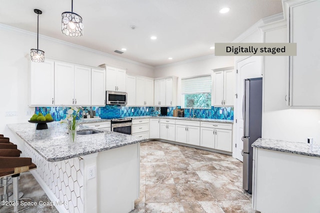 kitchen with stainless steel appliances, white cabinetry, a peninsula, backsplash, and crown molding