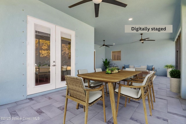 view of patio / terrace with french doors, a ceiling fan, and outdoor dining area