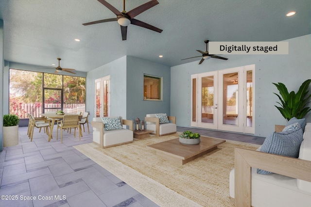 view of patio / terrace featuring french doors, ceiling fan, outdoor dining space, and an outdoor hangout area