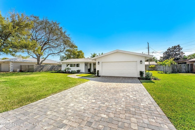 ranch-style house featuring a garage and a front yard