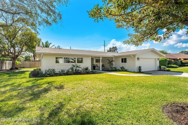 ranch-style home with a garage and a front yard