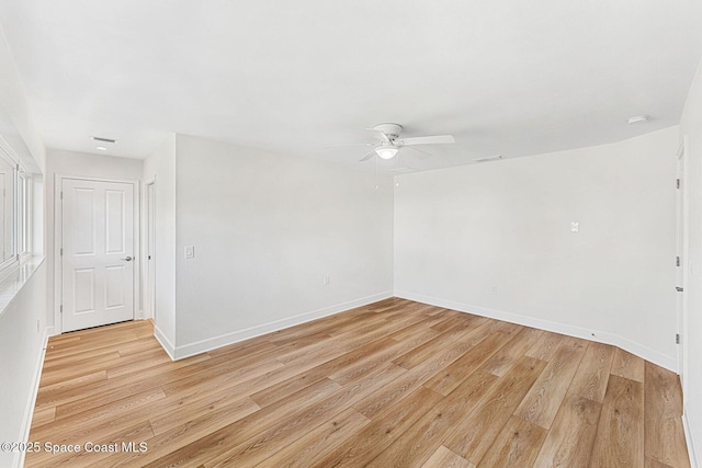 empty room with ceiling fan and light wood-type flooring