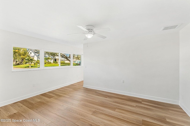 unfurnished room with ceiling fan and light wood-type flooring