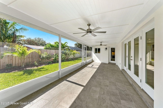 unfurnished sunroom featuring wood ceiling