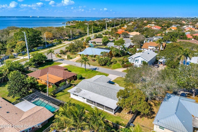 birds eye view of property featuring a water view