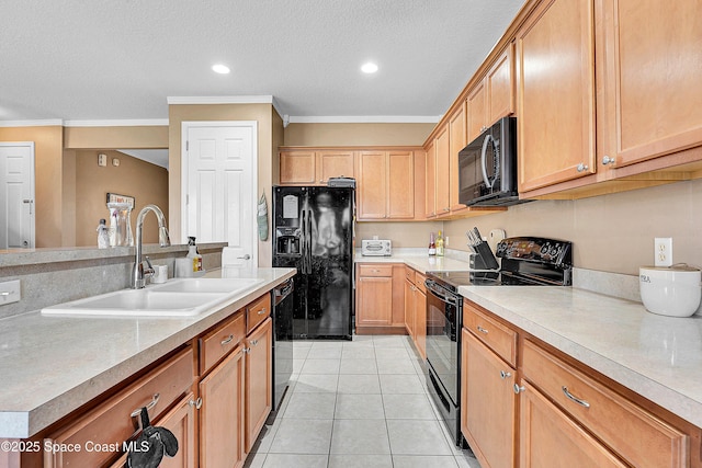 kitchen featuring crown molding, light tile patterned floors, sink, and black appliances