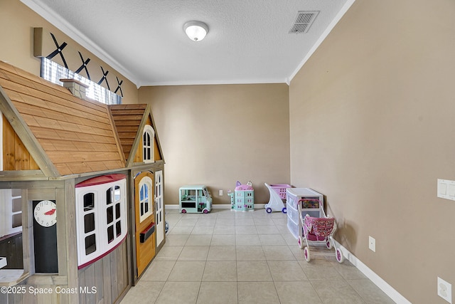 game room with light tile patterned floors, crown molding, and a textured ceiling