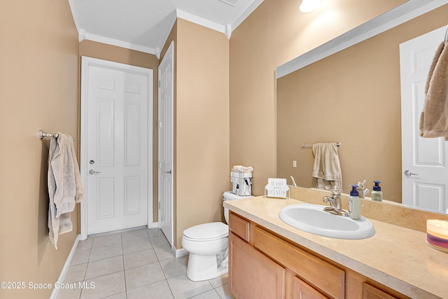 bathroom with tile patterned flooring, vanity, crown molding, and toilet