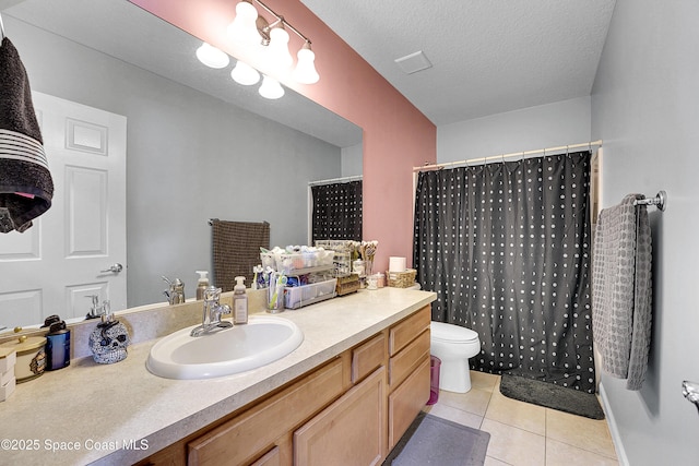 bathroom featuring toilet, a textured ceiling, vanity, a shower with shower curtain, and tile patterned flooring