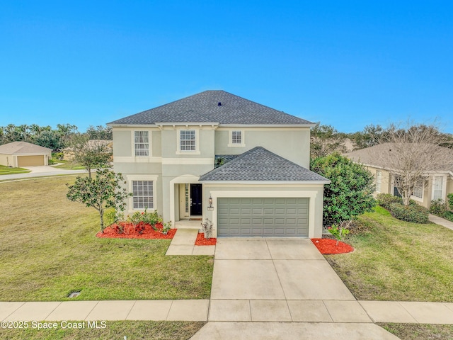 view of front of property with a garage and a front lawn