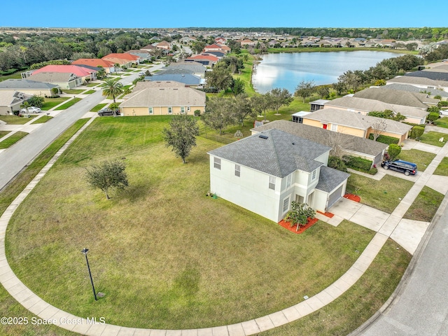 drone / aerial view with a water view