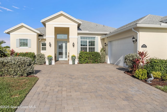 view of front of home with a garage