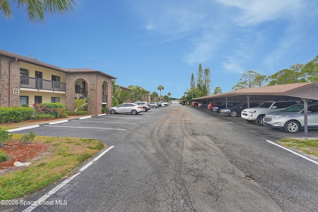 view of partially covered parking lot