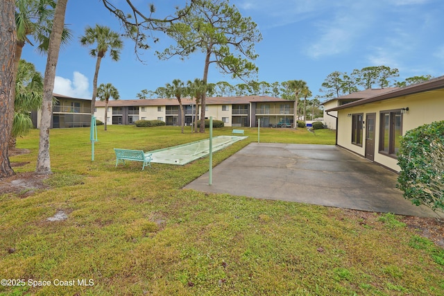 view of yard with shuffleboard