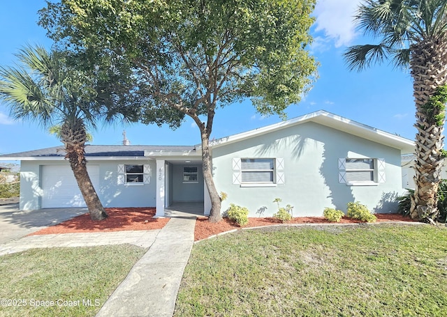 view of front facade with a garage and a front yard