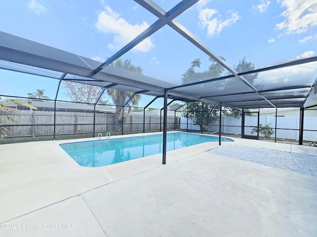 view of pool featuring a lanai and a patio