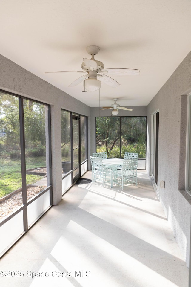 unfurnished sunroom featuring plenty of natural light