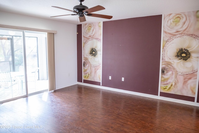 spare room with wood-type flooring and ceiling fan