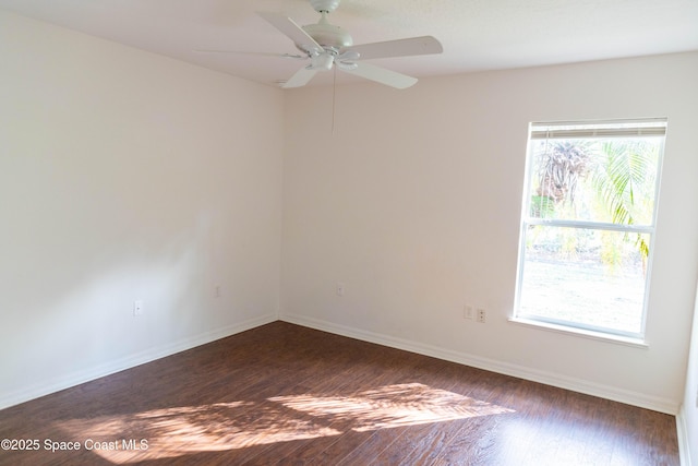 empty room featuring dark hardwood / wood-style floors and ceiling fan