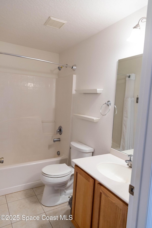 full bathroom featuring toilet, a textured ceiling, shower / tub combination, vanity, and tile patterned flooring