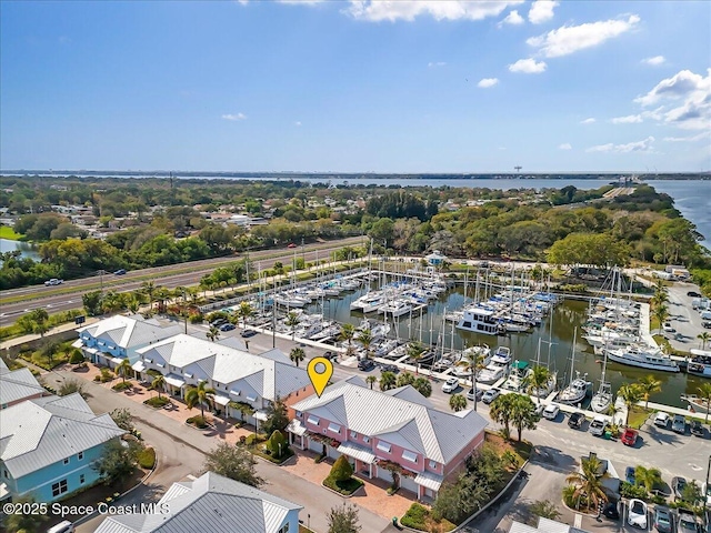 birds eye view of property featuring a water view