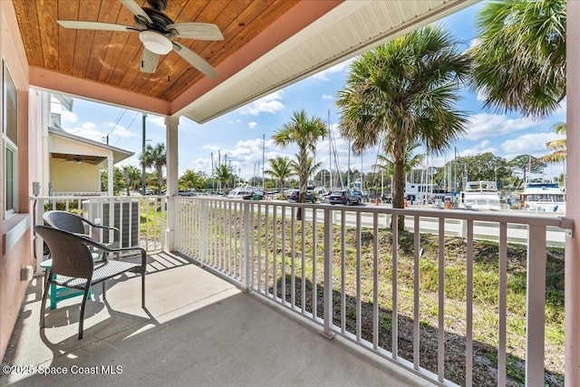 balcony featuring covered porch, central AC unit, and ceiling fan