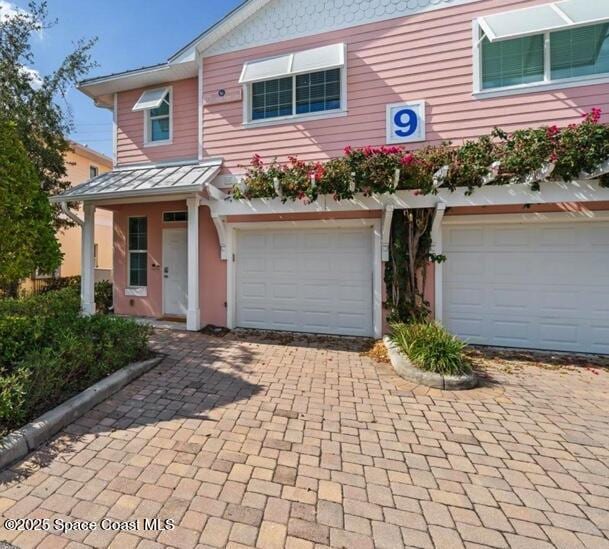 view of front of property featuring a garage