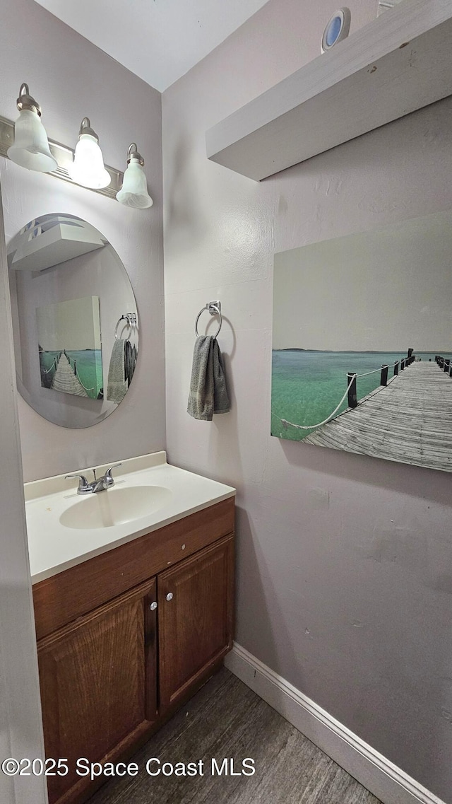 bathroom with vanity and hardwood / wood-style floors