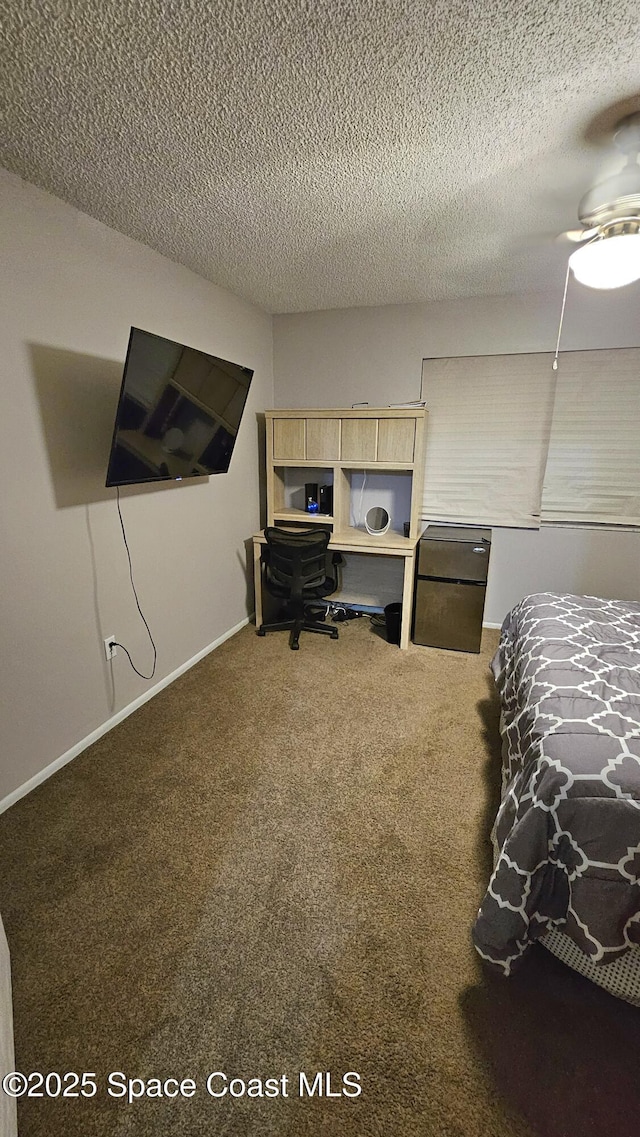 carpeted bedroom featuring a textured ceiling