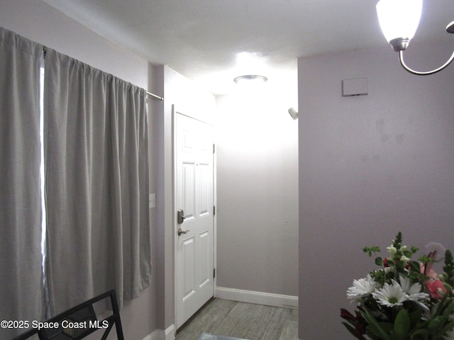 corridor featuring hardwood / wood-style flooring