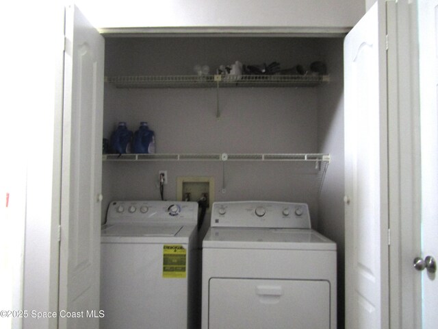 laundry room featuring washer and clothes dryer