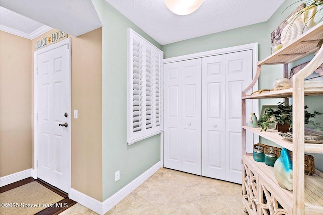 entryway featuring a textured ceiling