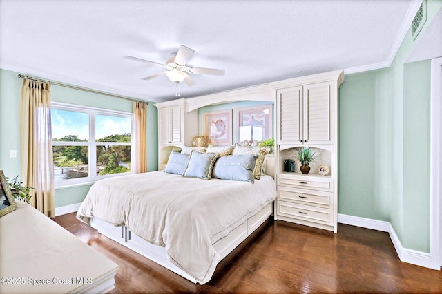 bedroom with ceiling fan, ornamental molding, and dark hardwood / wood-style floors