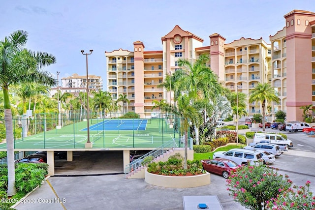 exterior space with uncovered parking and fence