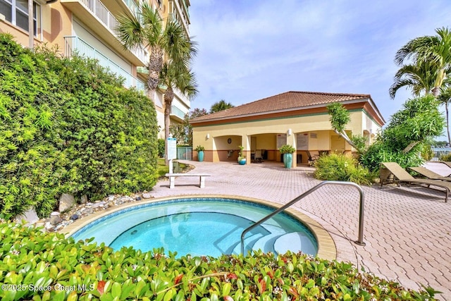 view of swimming pool with a patio