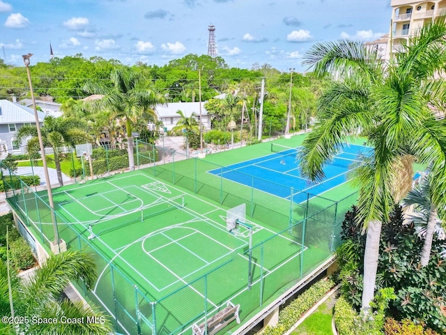 view of tennis court featuring basketball hoop