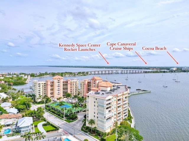 birds eye view of property with a water view