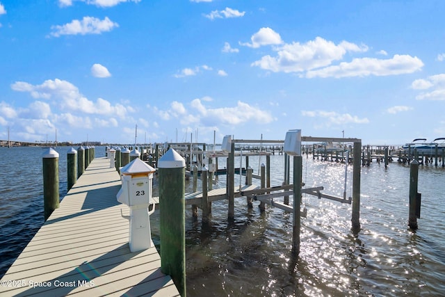 view of dock with a water view and boat lift