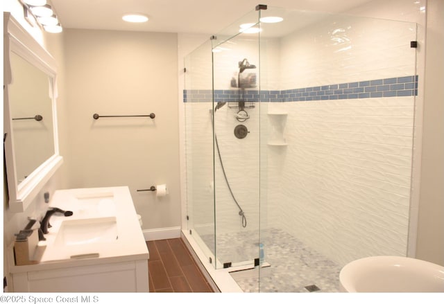 bathroom with vanity and an enclosed shower