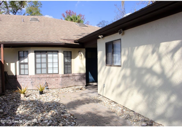 entrance to property with a patio