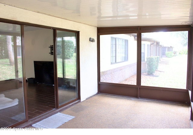 unfurnished sunroom with a wealth of natural light