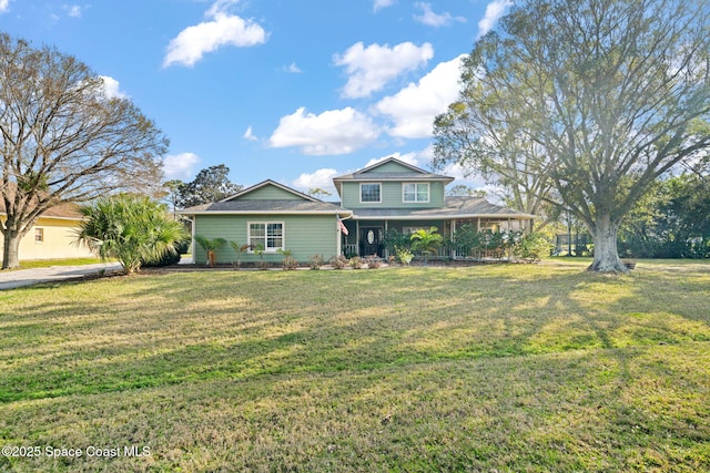 view of front of home featuring covered porch and a front yard