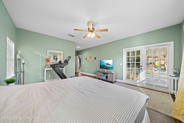 bedroom with access to exterior, hardwood / wood-style flooring, french doors, and ceiling fan