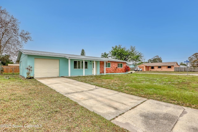 282 Hollywood Blvd, Melbourne, FL 32904 - ranch-style home with a garage and a front yard