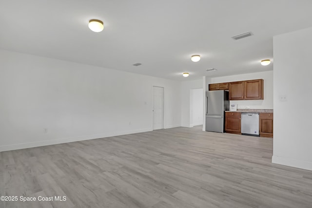 282 Hollywood Blvd, Melbourne, FL 32904 - unfurnished living room with light hardwood / wood-style floors