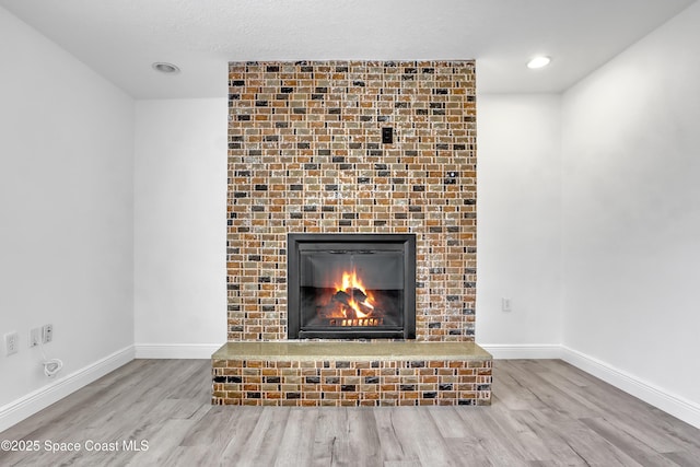 282 Hollywood Blvd, Melbourne, FL 32904 - room details featuring a fireplace and hardwood / wood-style floors